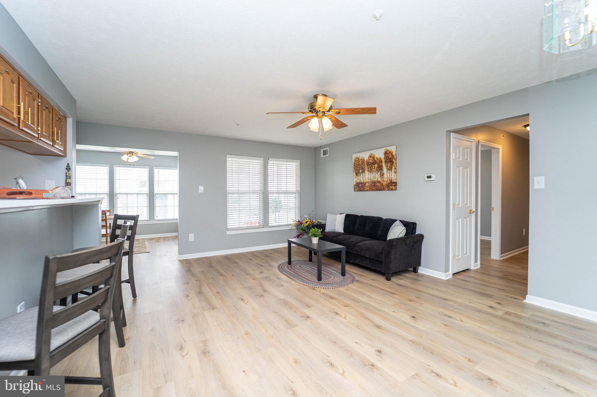 16 Laurel Path Court, Unit 1 Baltimore, MD 21236 - Photo 6 of 28 a living room with furniture and wooden floor