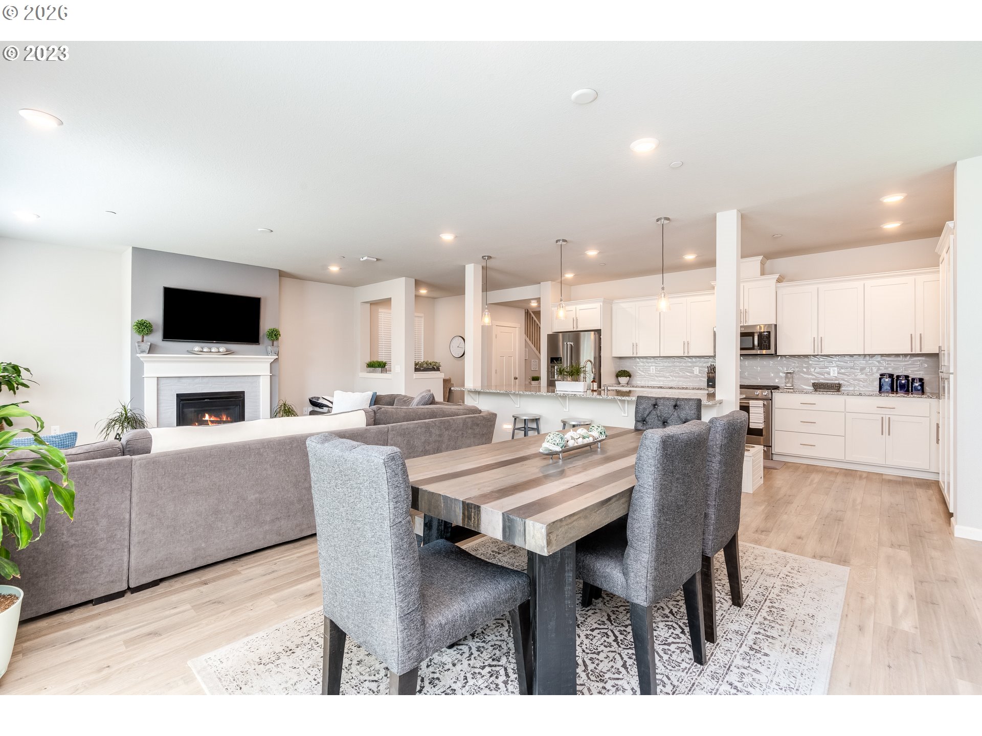 6150 North 86th Avenue Camas, WA 98607 - Photo 12 of 41 a dining room with a table chairs and a kitchen view