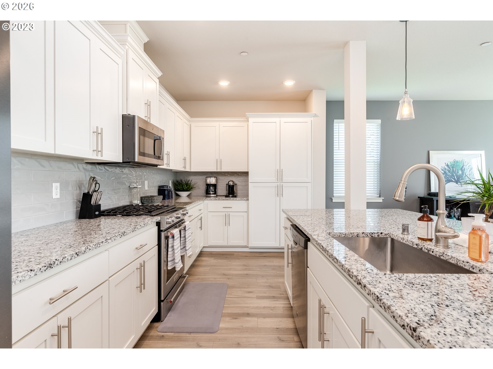 6150 North 86th Avenue Camas, WA 98607 - Photo 16 of 41 a kitchen with stainless steel appliances granite countertop a sink stove and refrigerator