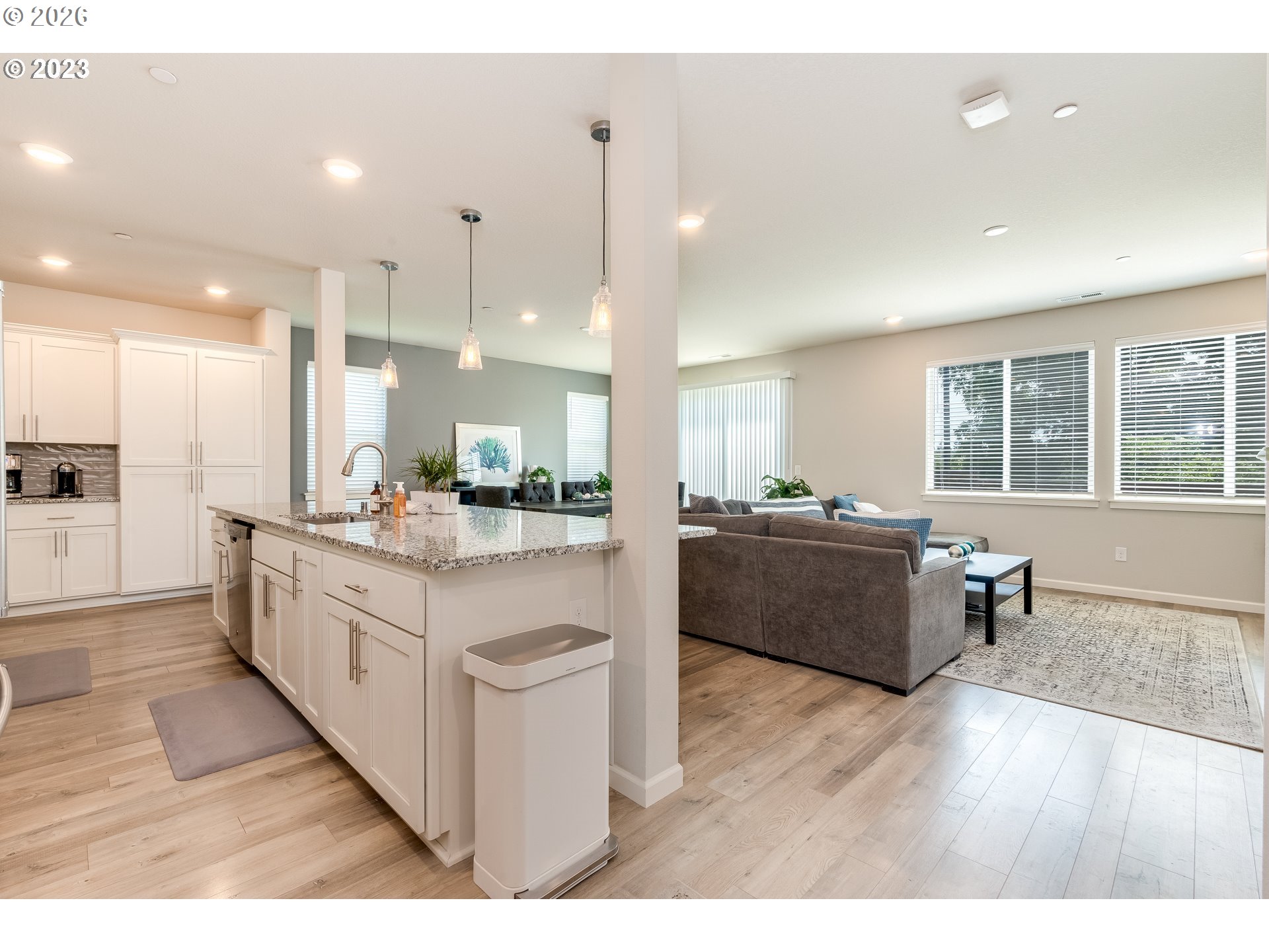 6150 North 86th Avenue Camas, WA 98607 - Photo 19 of 41 a large room with kitchen island granite countertop a large counter top and stainless steel appliances
