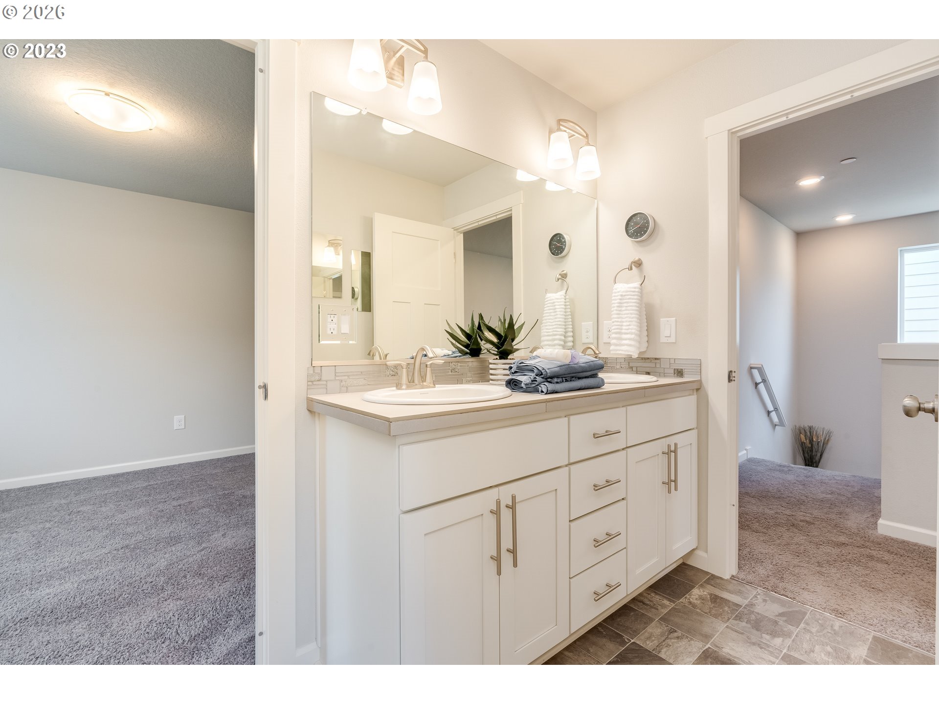 6150 North 86th Avenue Camas, WA 98607 - Photo 25 of 41 a bathroom with a double vanity sink and a mirror