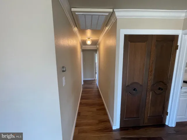 a view of gallery with wooden floor