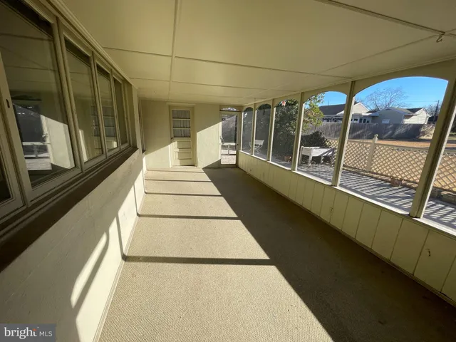 a view of a balcony with wooden floor
