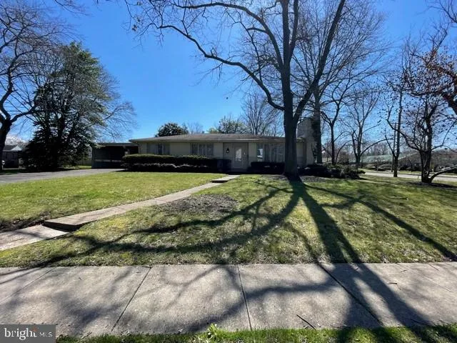 a view of a swimming pool with a yard