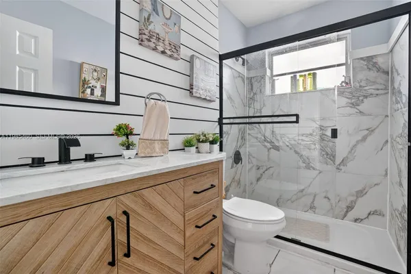 a view of an empty room with windows