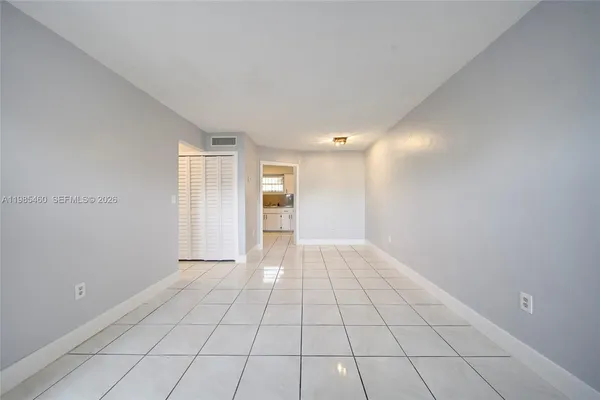 a view of an empty room and window
