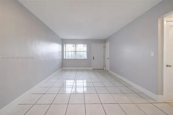 a view of an empty room and window