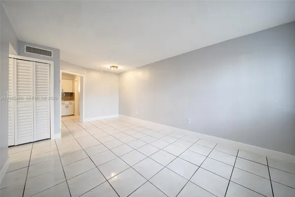 a kitchen with stainless steel appliances granite countertop a sink a stove a refrigerator and cabinets