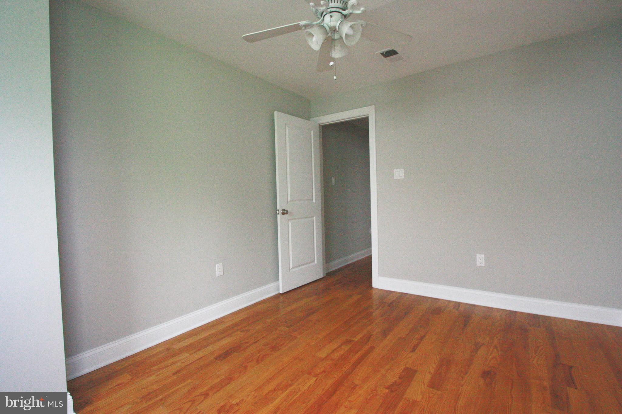 763 South 15th Street, Unit 2 Philadelphia, PA 19146 - Photo 12 of 12 a view of an empty room with wooden floor