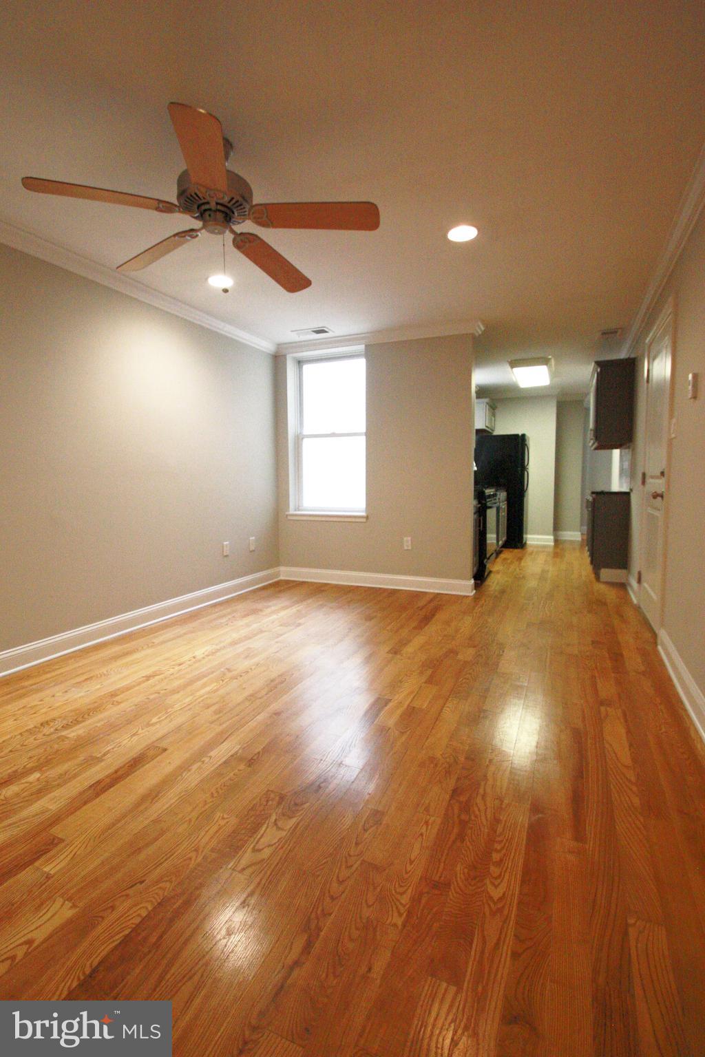 763 South 15th Street, Unit 2 Philadelphia, PA 19146 - Photo 3 of 12 a view of a big room with wooden floor and windows