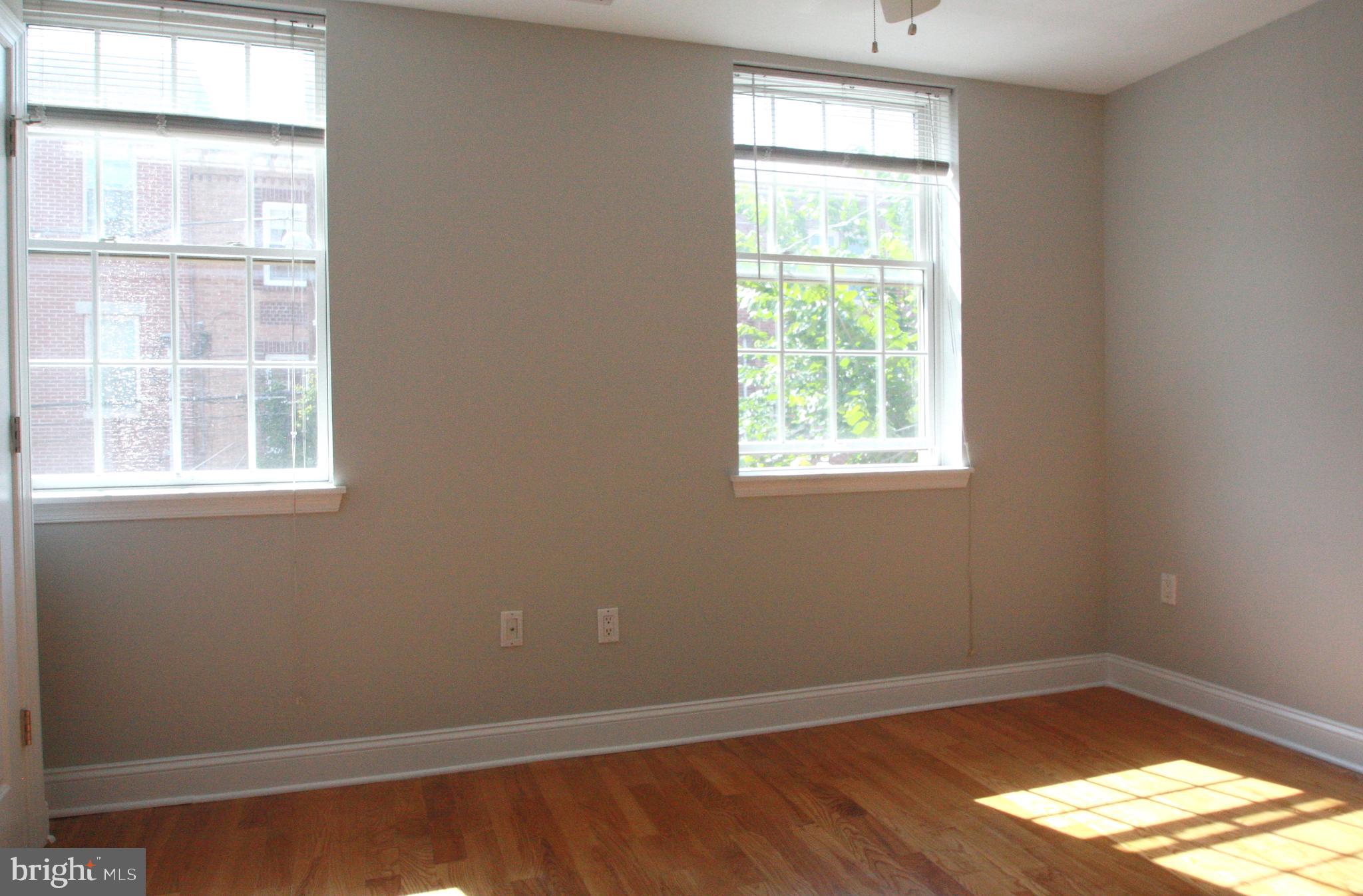 763 South 15th Street, Unit 2 Philadelphia, PA 19146 - Photo 5 of 12 an empty room with a window