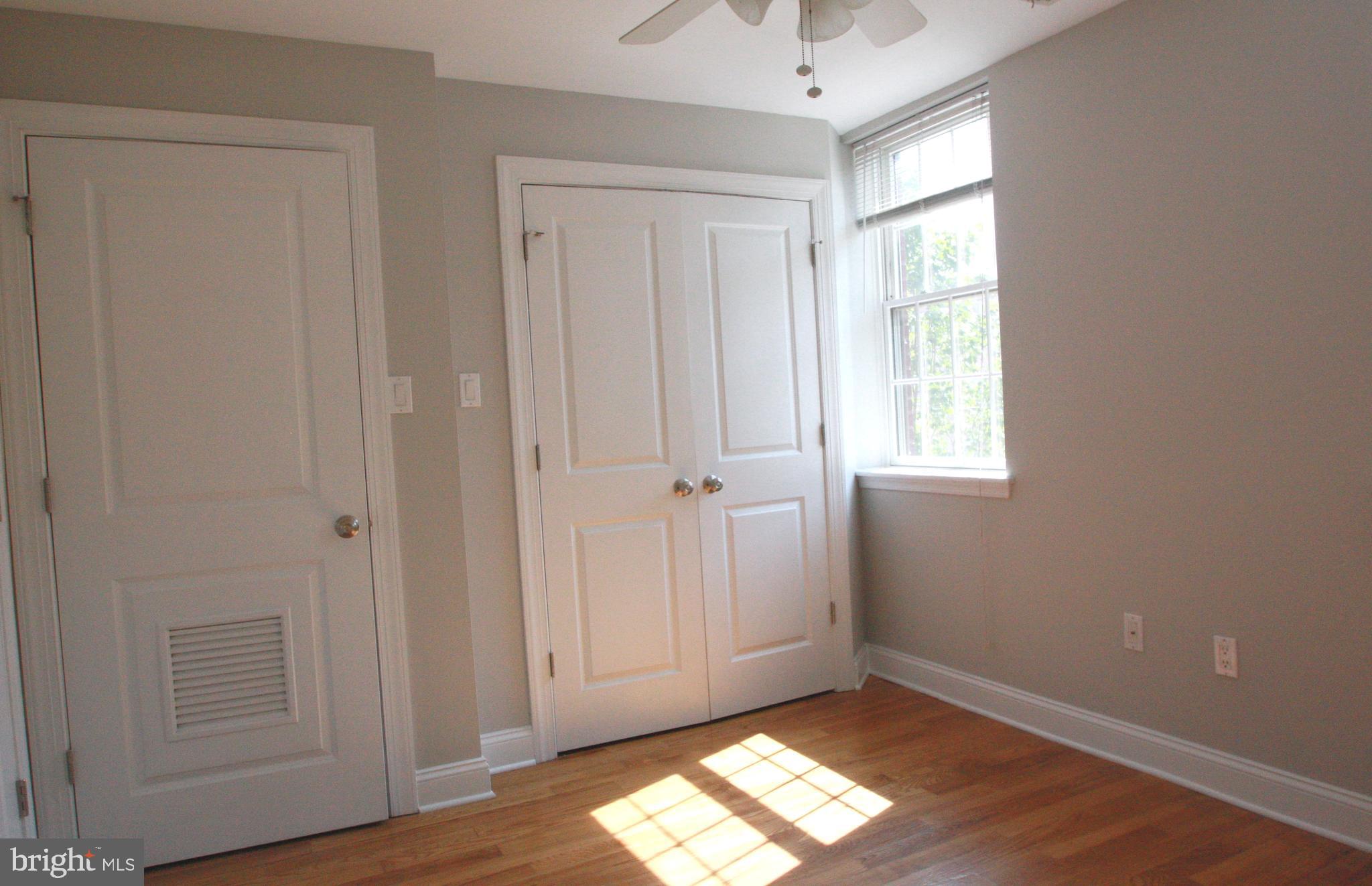 763 South 15th Street, Unit 2 Philadelphia, PA 19146 - Photo 7 of 12 a view of empty room with wooden floor and fan
