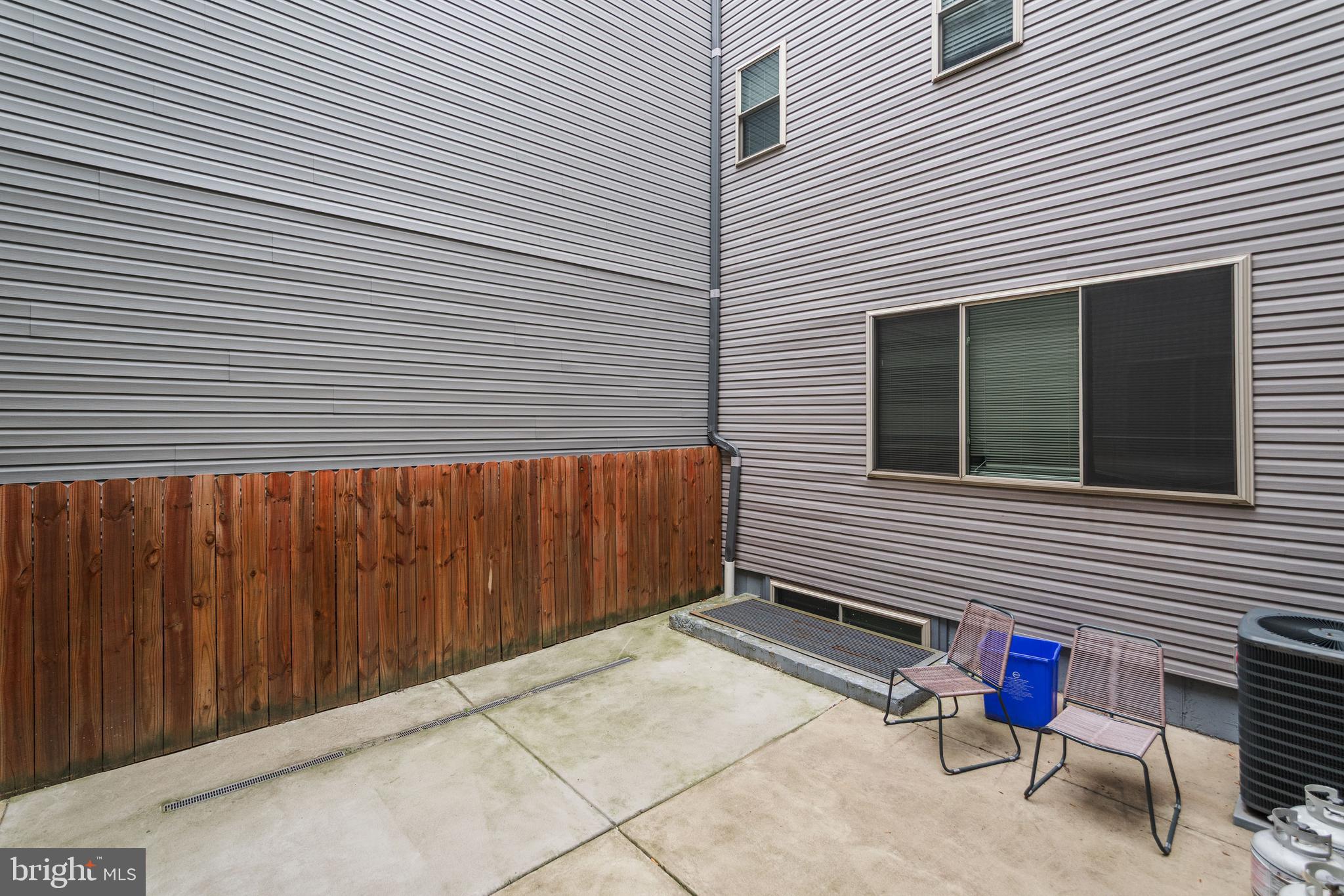 1524 North 8th Street, Unit 2 Philadelphia, PA 19122 - Photo 21 of 22 a backyard of a house with outdoor seating