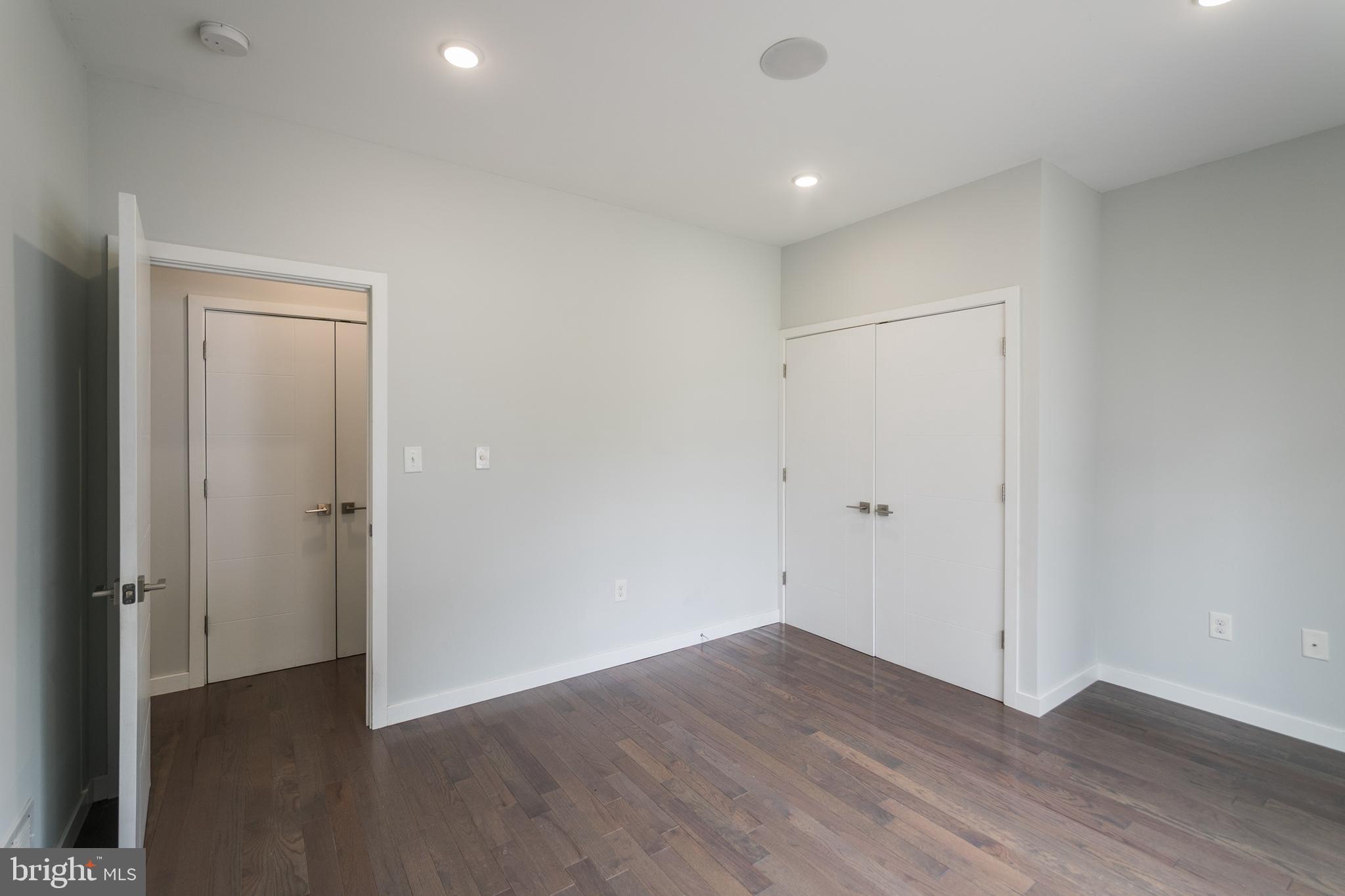 1524 North 8th Street, Unit 2 Philadelphia, PA 19122 - Photo 8 of 22 a view of an empty room with wooden floor