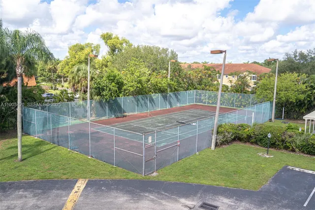 a front view of a house with a yard table and chairs