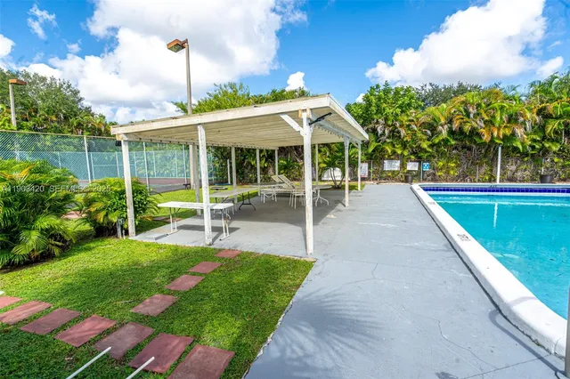 a view of a swimming pool with a patio