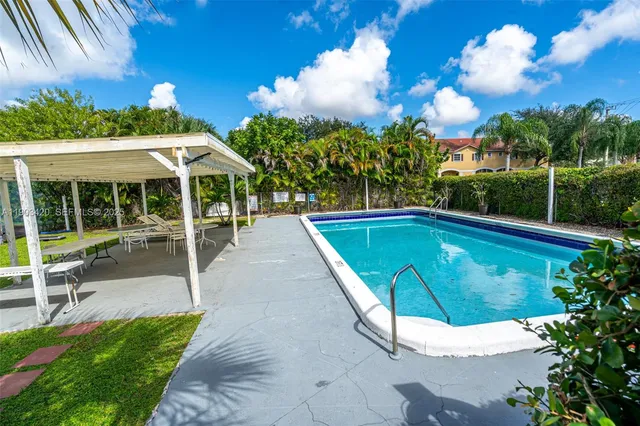 a view of a yard with an outdoor space