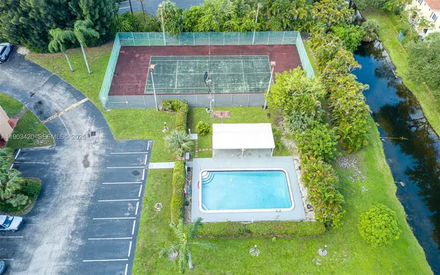 an aerial view of residential houses with outdoor space