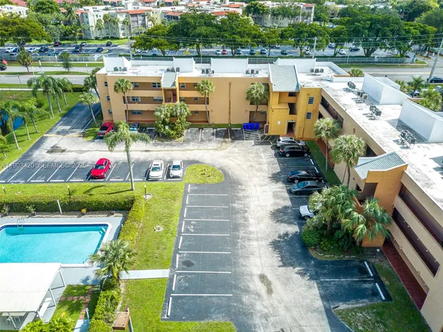 a view of a swimming pool with a patio