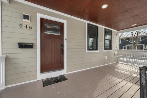 a view of a house with a door and wooden floor