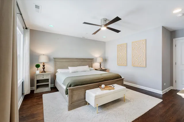 a white bath tub sitting next to a bathroom sink