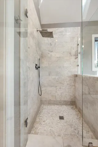 a utility room with closet and window