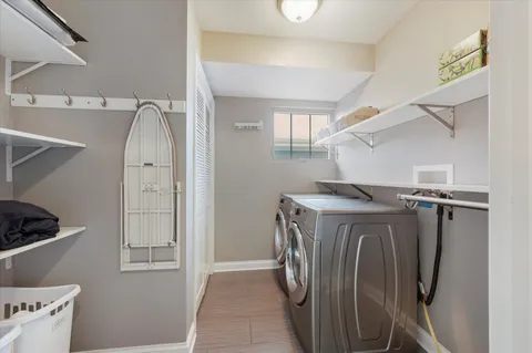 a view of entryway with wooden floor and stairs