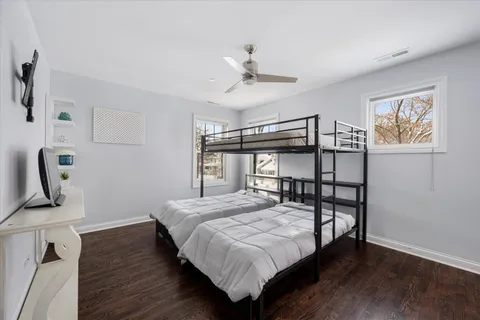 a spacious bedroom with a bed and a window