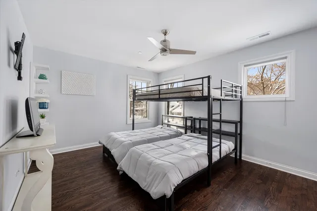 a spacious bedroom with a bed and a window