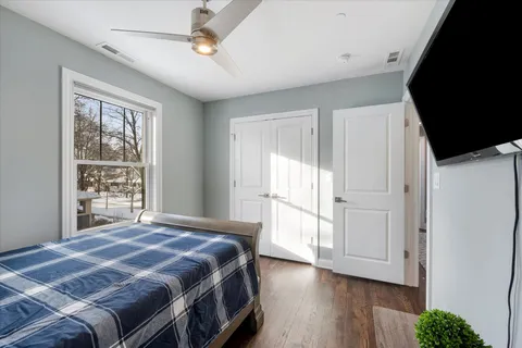 a black and white photo of a bench in a white building
