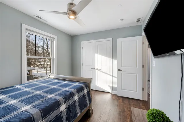 a black and white photo of a bench in a white building