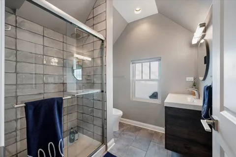 a living room with furniture and a book shelf