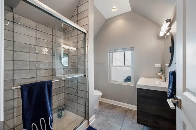 a living room with furniture and a book shelf