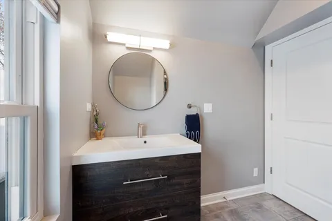 a view of a workspace with furniture and a flat screen tv