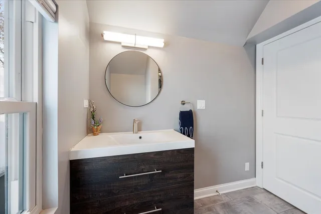 a view of a workspace with furniture and a flat screen tv