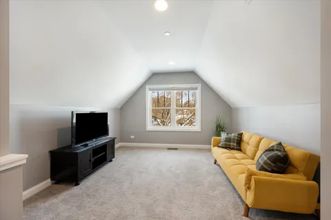 a house covered with snow in front of it