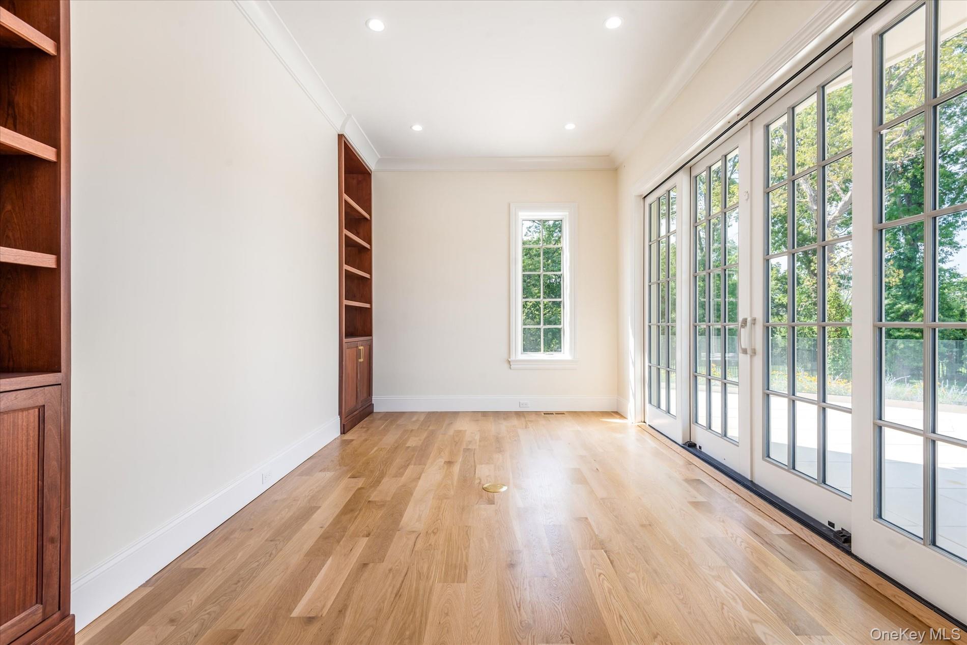 566 East Shore Road Great Neck, NY 11024 - Photo 15 of 50 a view of an empty room and wooden floor