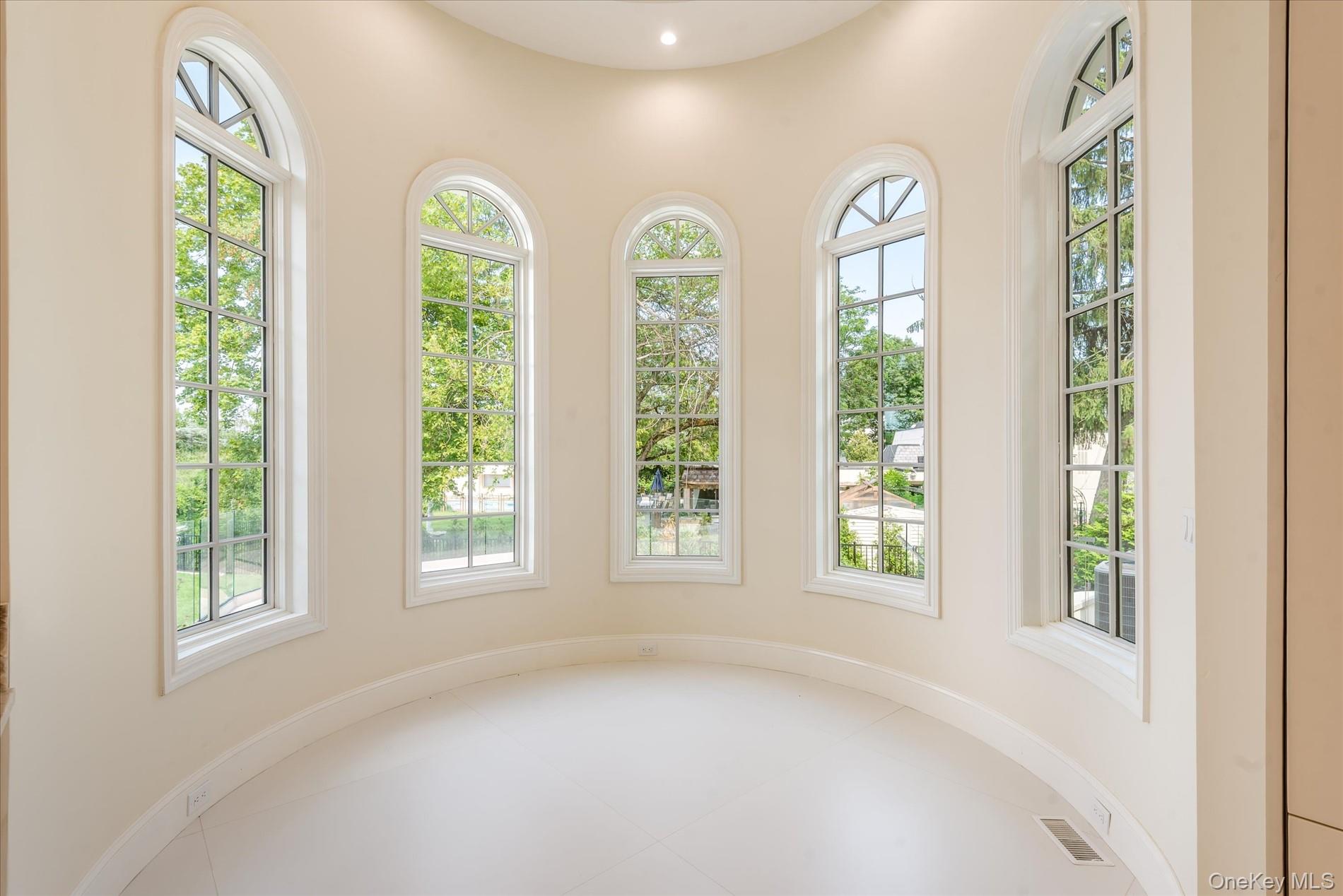 566 East Shore Road Great Neck, NY 11024 - Photo 20 of 50 an empty room with windows and view of balcony