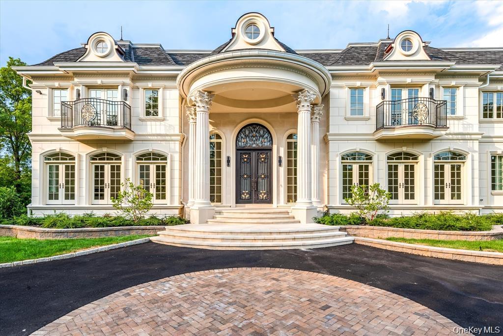 566 East Shore Road Great Neck, NY 11024 - Photo 2 of 50 a view of a brick house with a outdoor space