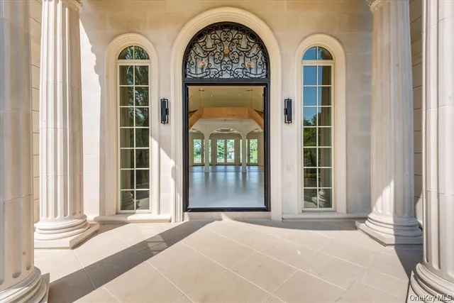 a view of front door with wooden floor