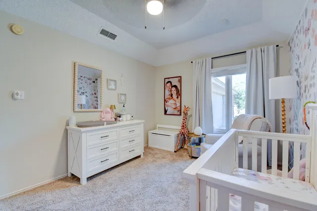a white bath tub sitting next to a window