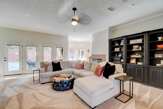 a bed room with furniture and a flat screen tv
