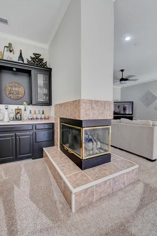 a view of a dining room with furniture and a kitchen