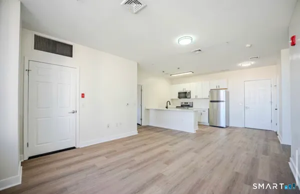 a view of kitchen with wooden floor
