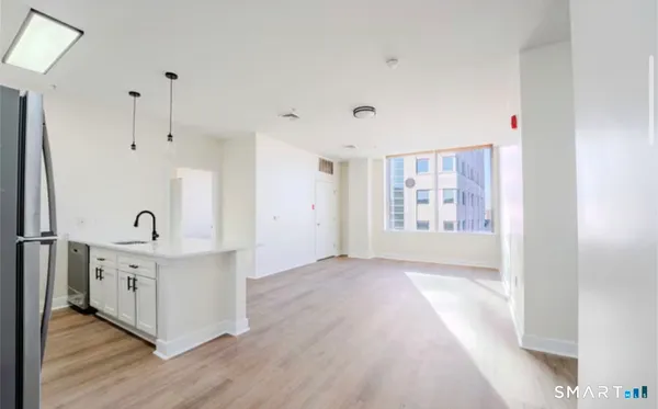 a view of a kitchen with electric appliances