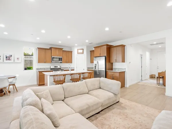 a view of a dining room with furniture and a window