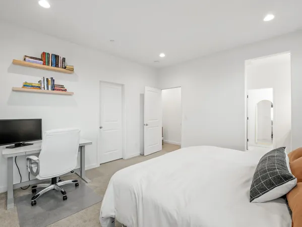 a bathroom with a granite countertop sink a mirror and a shower