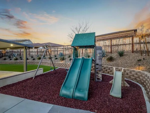 a view of a house with backyard porch and sitting area