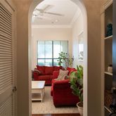 a living room with furniture and a potted plant