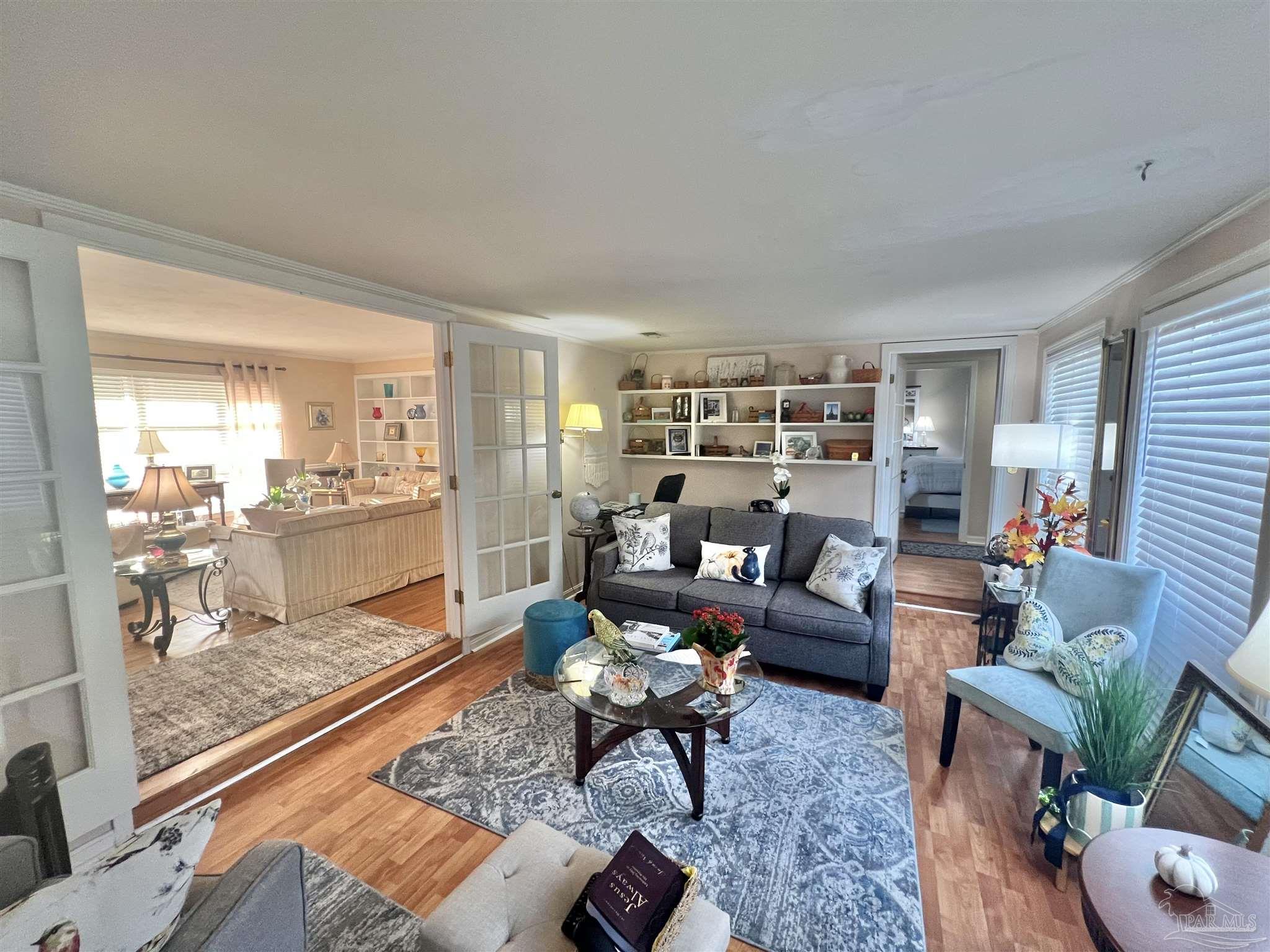 205 Highland Avenue Atmore, AL 36502 - Photo 17 of 43 a living room with furniture and a large window